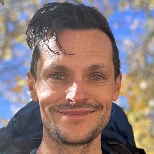 A headshot of the very svelte looking game engineer James Marr on a beautiful fall day